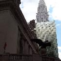 The corner of Grand Central Terminal train station with the Chrysler Building in the background